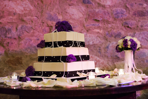 tiered square wedding cake with plum ribbo and pearls - photo by Melissa Jill Photography